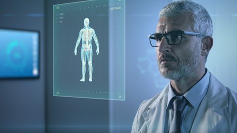 high tech futuristic hospital,man doctor working with augmented reality,scientist male in uniform examines 3d human body organs in laboratory with artificial intelligence