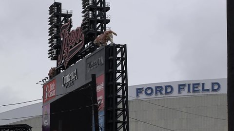 Detroit , Michigan / United States - 09 29 2020: Only grey clouds move in static shot of Comerica Park and Ford Field