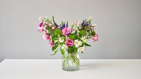 Stop motion. Bouquet 007, step by step installation of flowers in a vase. Flowers bunch, set for home. Fresh cut flowers for decoration home. European floral shop. Delivery fresh cut flower.