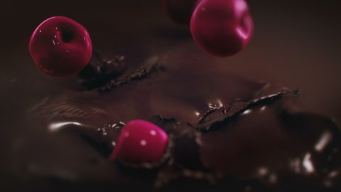Cherries Splashing Into Liquid Dark Chocolate in 4K Super slow motion