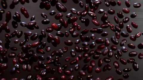 Wonderful tasty beans on a black background. Super slow motion. Macro