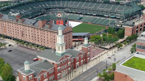 Baltimore , MD / United States - 08 23 2020: Camden Station, Oriole Park at Camden Yards, home of MLB Orioles Baseball Team. Beautiful aerial reveal shot.
