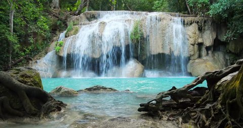 Erawan waterfall in Thailand. Idyllic tropical paradise nature background 