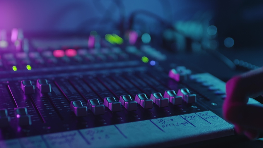 Soundboard Pads On TV Station.Sound Designer Used Digital Audio Mixer In Production Studio.Sound Engineer Moving Sliders In Radio Station.Engineer Press Key Buttons On Control Desk Recording Studio Royalty-Free Stock Footage #1060714840