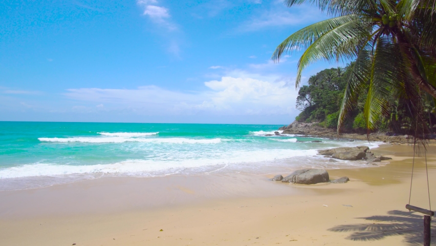 Phuket Thailand beach sea. Landscape view of beach sea and sand in summer sun. Beach space area background. At Patong beach, Phuket, Thailand. On 16 October 2020. 4K UHD Videoclip 3840x2160P 29.97.FPS Royalty-Free Stock Footage #1060723945