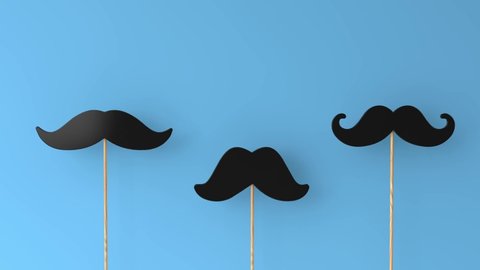 moustaches on a blue background. Father's day or mens health concept