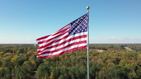 Large American Flag Waving Flies 4K Aerial Drone View Footage National American Celebration - Labor Day, Independence Day, Flag Day, Memorial, Veterans, Patriots, President Day
