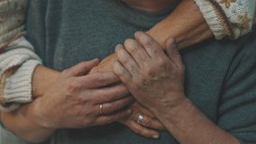 close up wrinkled hands. Happy old couple hugging in park. Senior man flirting with elderly woman. Romance at old age dancing on autumn day. High quality 4k footage - Powered by Shutterstock - Get 15% off with code: PIKWIZARD15