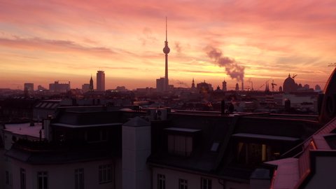 Wide Establishing Aerial Sunset or Sunrise Shot of Berlin, Germany Skyline with Red Sky