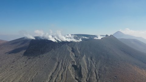 MIYAZAKI, JAPAN. gases vent from the caldera of the volcano Shinmoedake. active stratovolcano, located at the junction of Miyazaki and Kagoshima prefectures. Height is 1421 meters.(aerial view)