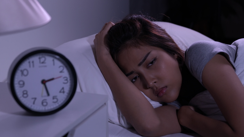Depressed young Asian woman cannot sleep from insomnia. Depressed woman suffering from insomnia lying in bed. | Shutterstock HD Video #1060746472