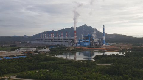 Aerial view, Panoramic view of coal-fired power plants in a large area The machine is working to generate electricity. Beautiful morning sunrise sky, Mae Moh, Lampang Province, Thailand.