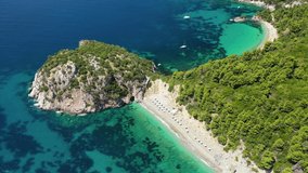 Aerial drone video of famous Stafilos and Velanio turquoise sea beaches, Skopelos island, Sporades, Greece