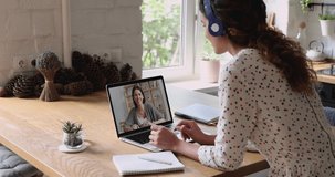 Businesswomen communicate by video conference use laptop app and internet connection, due corona virus solve business remotely. Girlfriends talking by videocall easy modern comfort conversation method