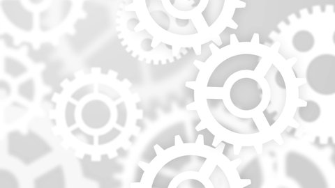 Abstract computing technology concept for business, finance and industry with gears. White cogwheels on gray blurred bokeh background.