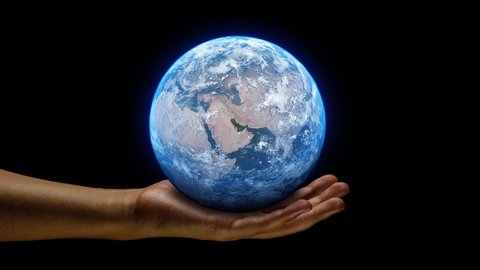 Hand holding a realistic earth planet. Ruling power concept using earth on hands. World globe spinning from asia to europe.
