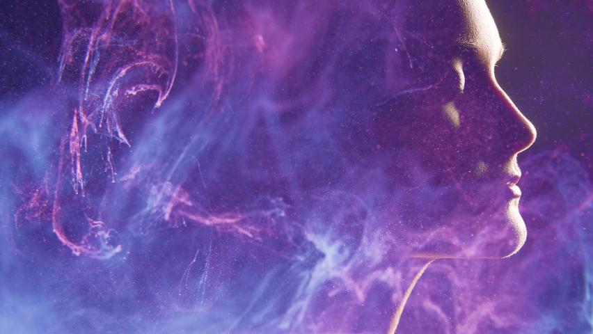 Female universe. Spiritual aura. Double exposure peaceful woman face silhouette in neon glow purple blue smoke motion abstract background. Enlightenment nirvana zen. Healing energy. Astral eternity. | Shutterstock HD Video #1060772932