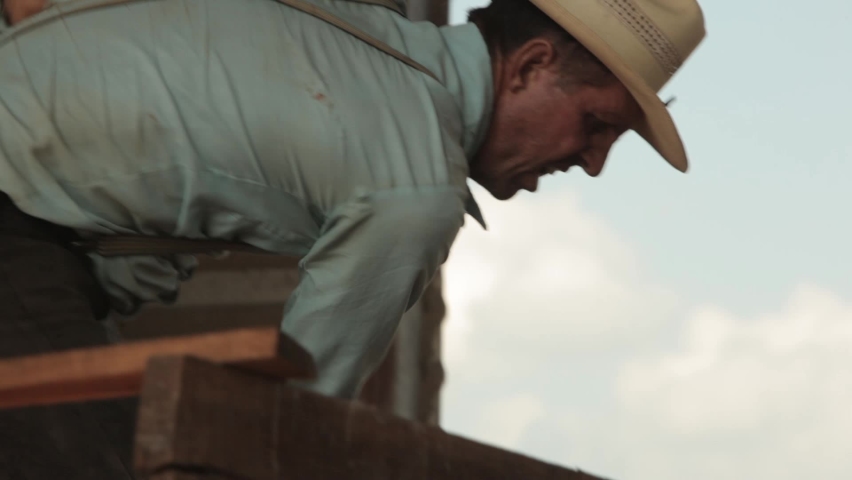 Bacalar, Quintana Roo, Mexico - 13.04.2016. Mennonite. Grain unloading. A man does physical work.