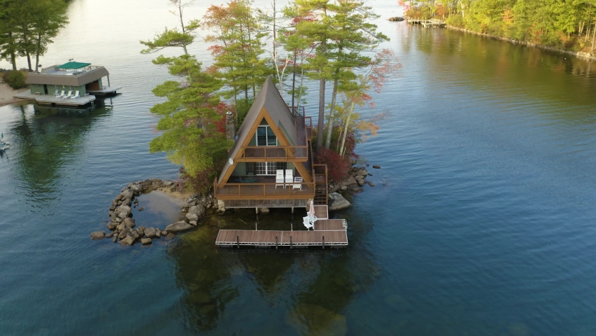 A frame cabin island on lake in New Hampshire, USA - 4K Drone footage