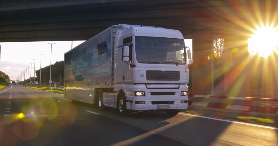 Hydrogen fueled truck on the road drinving. h2 combustion Truck engine for emission free ecofriendly transport.  | Shutterstock HD Video #1060784038