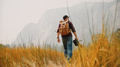 Filmmaker with professional camera in Yosemite National Park / Videographer, DP, Cinematographer  