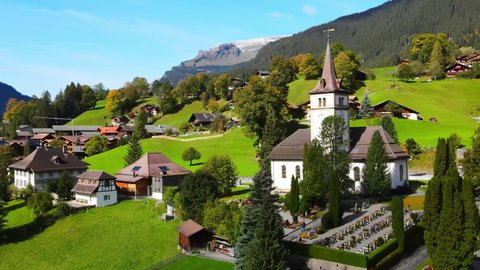 Famous city of Grindelwald in the Swiss Alps from above - drone footage