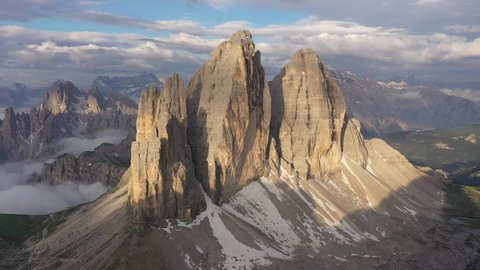 Early morning aerial view of stunning peaks of 'Tre Cime di Lavaredo', beautiful natural scenery and popular tourist attraction in the Dolomites mountains in Italy Europe

