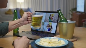Close up : Attractive young happy asian man enjoy relax night party event online celebration festive with friends at home clinking beer with glass and bottle toasting drinking via video call. - Powered by Shutterstock - Get 15% off with code: PIKWIZARD15