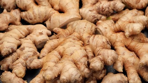 whole ginger root on close up rotating