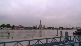 Time Lapse of Wat Arun Ratchawararam temple with reflexion in the river ,Bangkok Thailand
