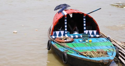 A colourful boat sways on the banks of Hooghly River at Princep Ghat in Kolkata, West Bengal, India- 17 Sep 2020
