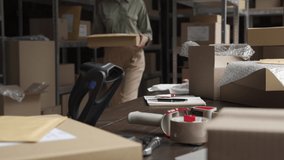 Female seller online store worker holding scanner scanning parcel bar code packing e commerce post shipping box preparing online retail shop order in dropshipping delivery service warehouse. - Powered by Shutterstock - Get 15% off with code: PIKWIZARD15