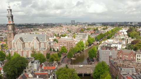 Flight above Anne Frank House and beautiful Church in Amsterdam, circling Aerial
