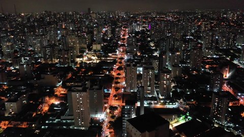 Aerial landscape of colorful city at night. Great night landscape. Famous Pompeia Avenue, Sao Paulo. Downtown city aerial view. Downtown city at night. Night life aerial view. Nightlife avenue view