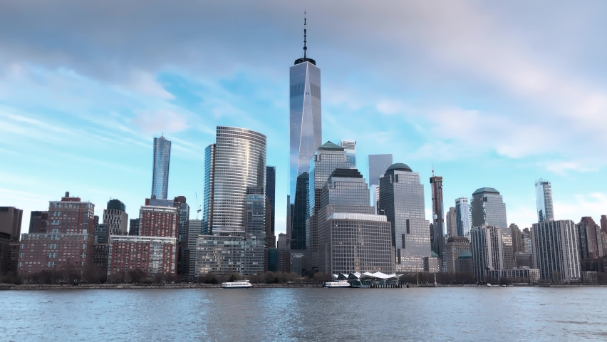Downtown Manhattan skyline from the ferry tour at winter sunset, New York City. Slow motion. Royalty-Free Stock Footage #1060836241