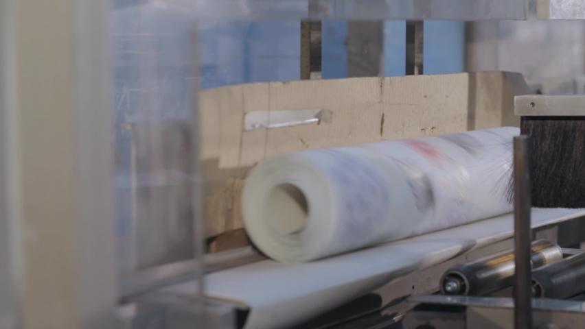 Modern wallpaper production plant. Conveyor line of wallpaper production, wallpaper production plant