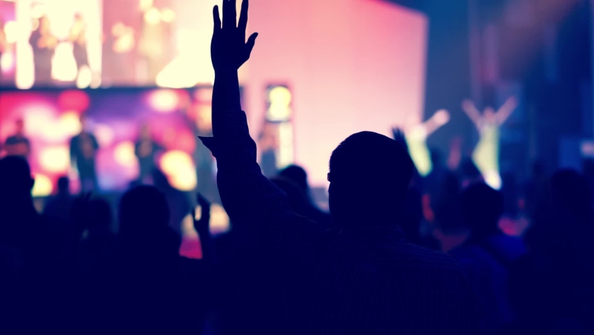 People raise their hands to worship God./Film old film. | Shutterstock HD Video #1060839469