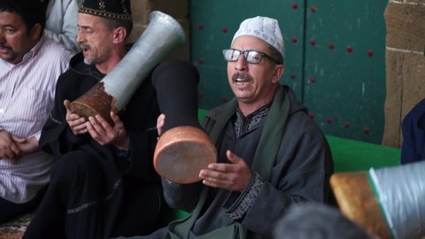 Essaouira , Meṛṛakec-Asfi / Morocco - 02 09 2014: At Zawiya Hamdouchia, men play drums, sing, and play rhaita during a sufi event in Essaouira, Morocco.
