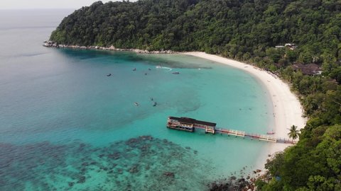 footage of the beautiful bluish water of Perhentian Island in Terengganu, Malaysia. Nature tourism provides the economic base for the islands. Both the islands have palm-fringed white coral sand beach