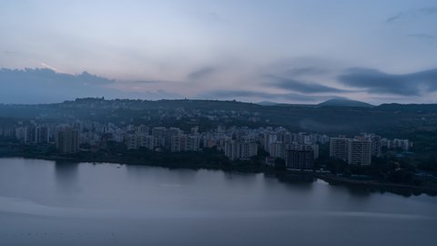 Beautiful 4k Sunrise Time Lapse, Cityscape view and and Reflection in the Lake water, Maharashtra, India