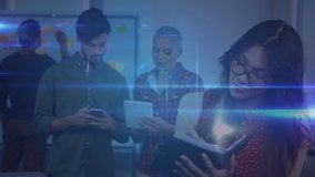 Animation of network of digital icons over colleagues using digital tablets and making notes in office. Global online network digital interface technology concept digitally generated image. - Powered by Shutterstock - Get 15% off with code: PIKWIZARD15