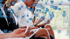 Animation of multiple digital icons floating over team of people using electronic devices at conference. Global online network digital interface concept digitally generated image. - Powered by Shutterstock - Get 15% off with code: PIKWIZARD15