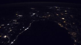 ISS Time-lapse Video of Earth seen from the International Space Station with dark sky and city lights at night over Nile , Time Lapse 4K. Images courtesy of NASA. Pan up motion timelapse.