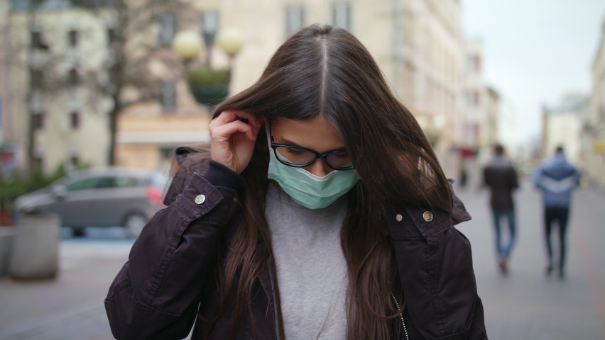 Portrait Of A Young Woman Wearing Protective Coronavirus Mask On Street. Concept Of Health And Safety Life