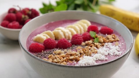 Acai berry superfood smoothie bowl with superfood toppings. Plant based diet food