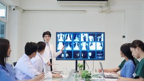 Leader medical team presenting symptoms of patient with x-ray at hospital. Doctor brainstorming examination of the symptoms patient at meeting room. - Powered by Shutterstock - Get 15% off with code: PIKWIZARD15