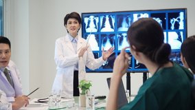 Leader medical team presenting symptoms of patient with x-ray at hospital. Doctor brainstorming examination of the symptoms patient at meeting room. - Powered by Shutterstock - Get 15% off with code: PIKWIZARD15