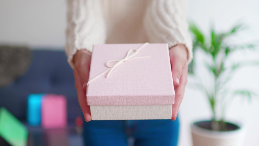Giving a gift box for holiday to beloved people  Royalty-Free Stock Footage #1060863262