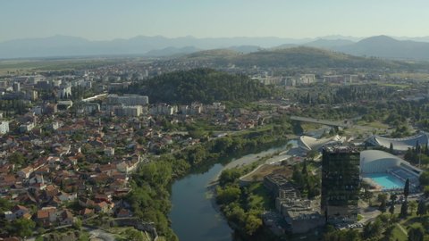 Podgorica, Montenegro - August, 2020: aerial view of Podgorica capital city of Montenegro. Drone shot on a panorama of the city where you can see the river bridges and the old city.