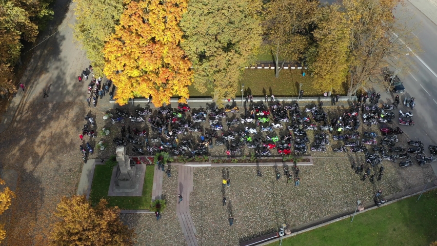Motorcycle bikers in autumn town square, Lithuania, aerial view